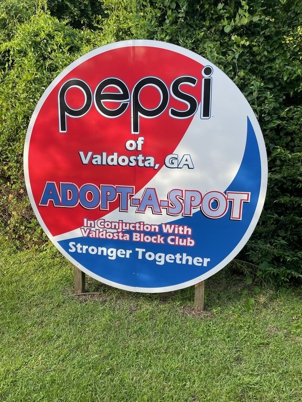 [Pepsi Adopt-A-Spot sign]