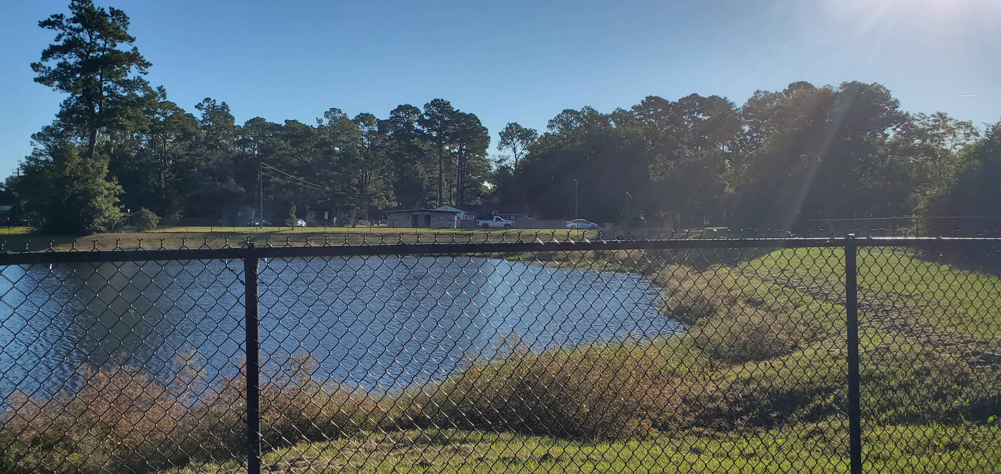 Fence and detention pond, 2022:10:18 09:11:40, 30.8469103, -83.2793843