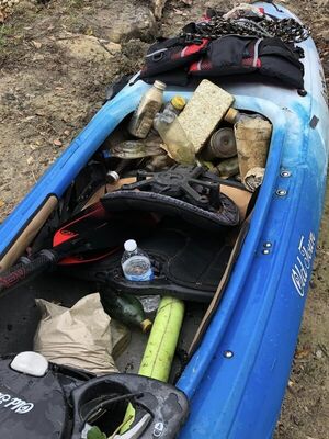 [We found a floating cooler. Filled it with trash and mounted it to Bobby’s kayak. --Russell Allen McBride]