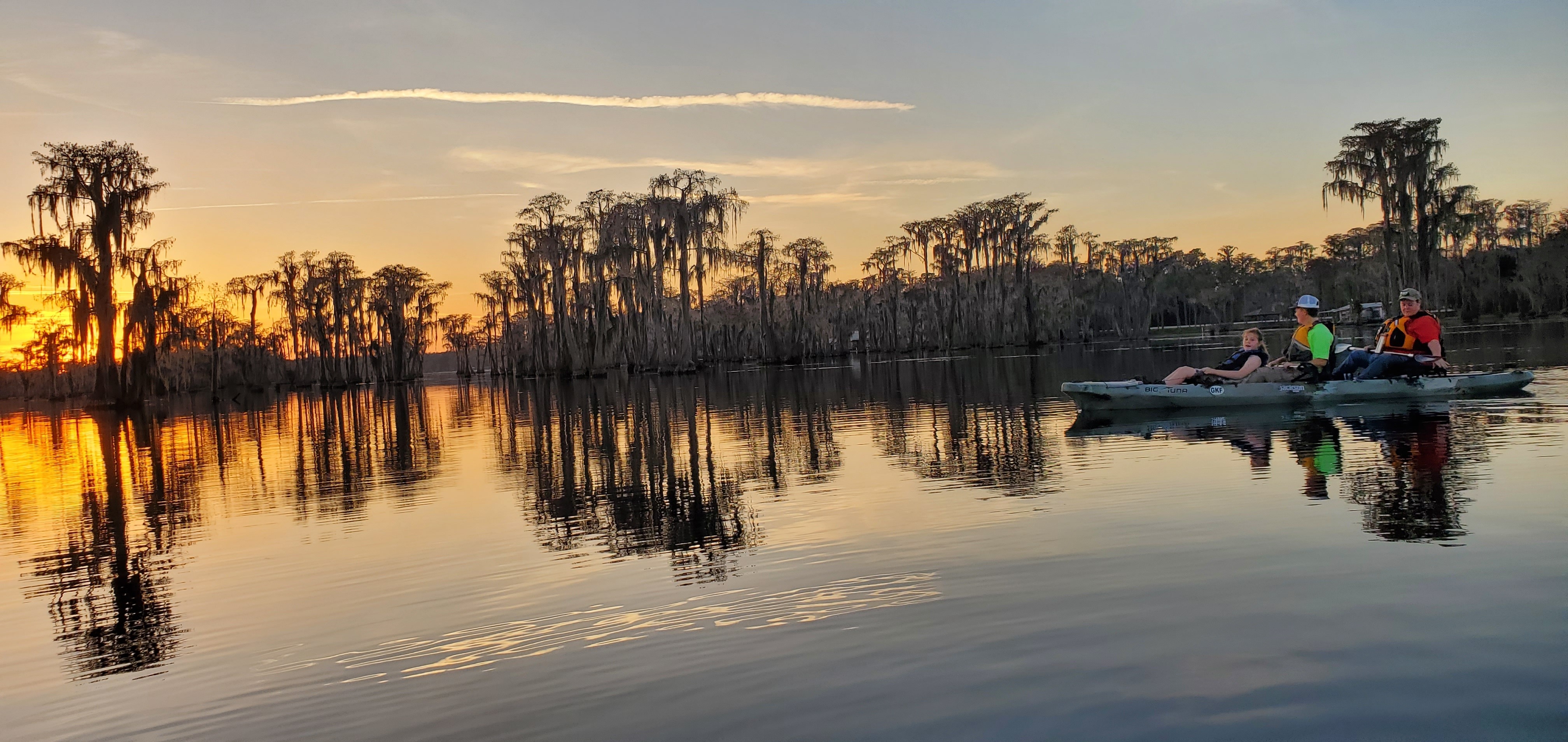 The Jones family rides the raffle kayak into the sunset