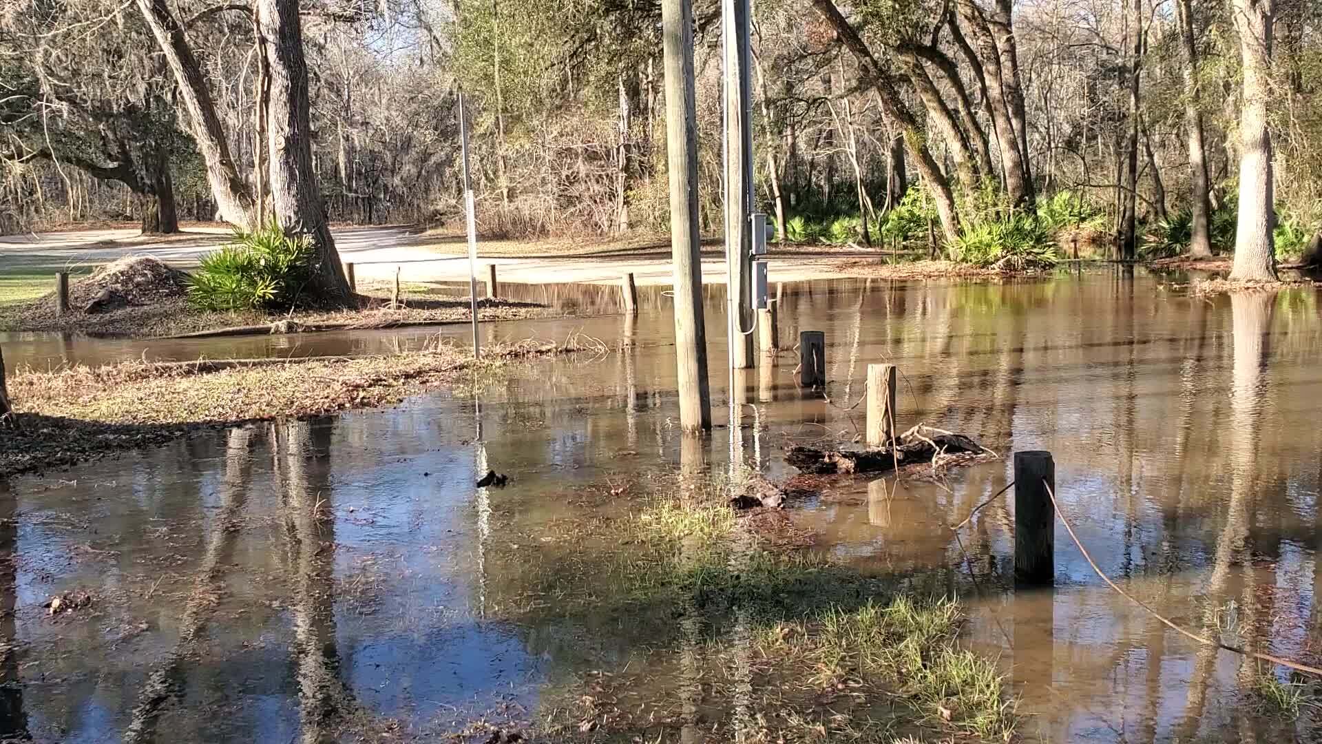 Movie: Water flowing down the driveway into Langdale Park Boat Ramp, 16:31:37, 30.8873447, -83.3235757 (26M), 2023-01-26