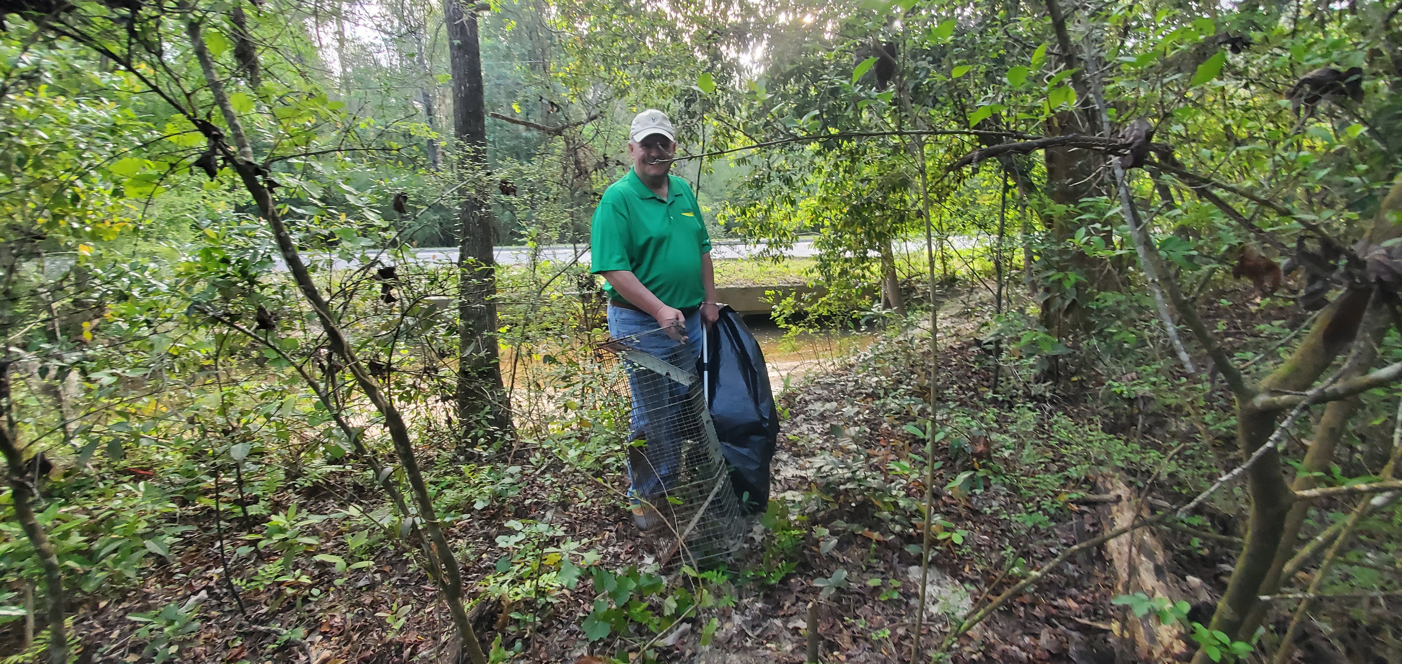 Tim Carroll and the animal trap he spotted, 2023:03:25 08:41:10, 30.8633846, -83.3020699