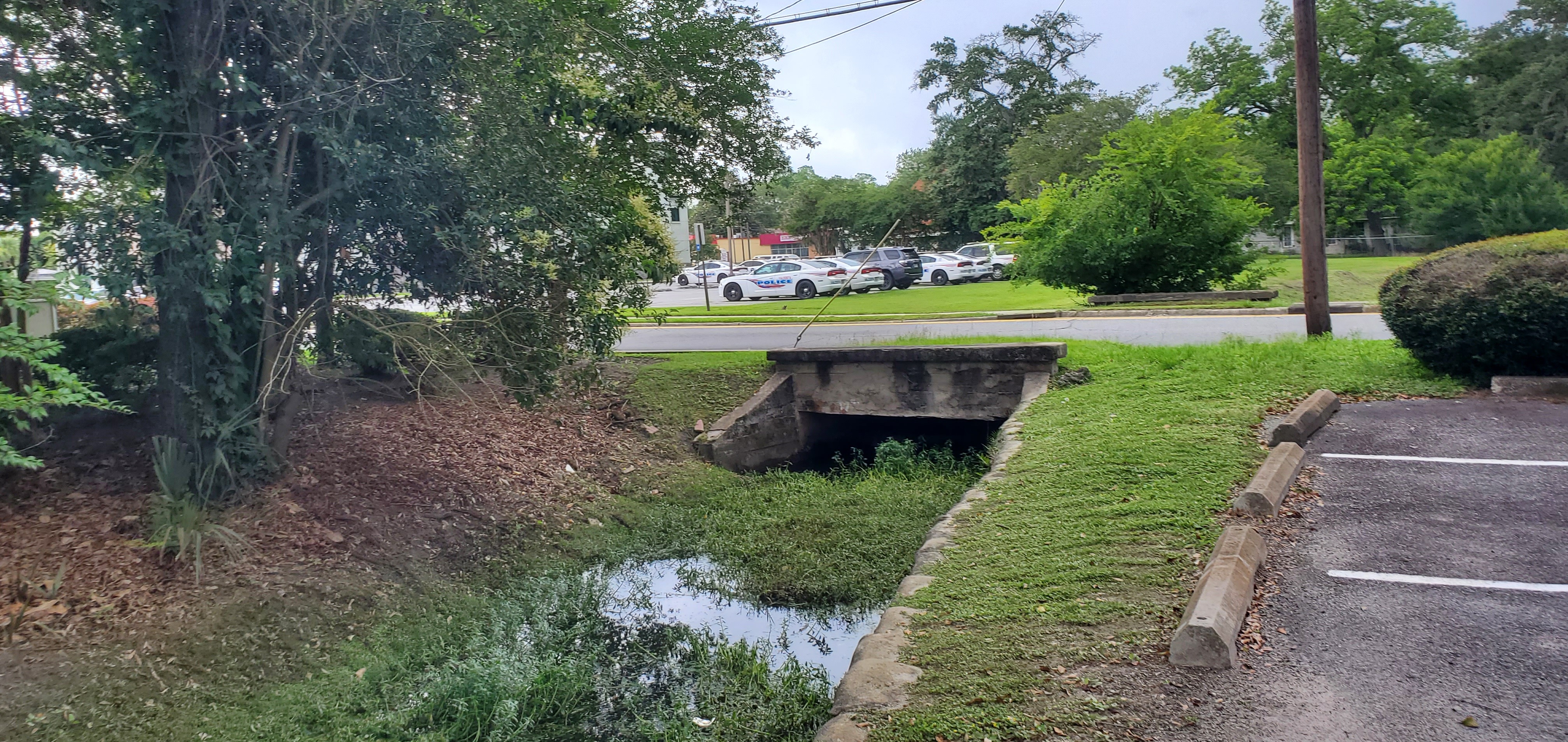 N Thoombs Street culvert, Browns Canal, police cars, 2023:05:23 15:48:43, 30.8356715, -83.2828164