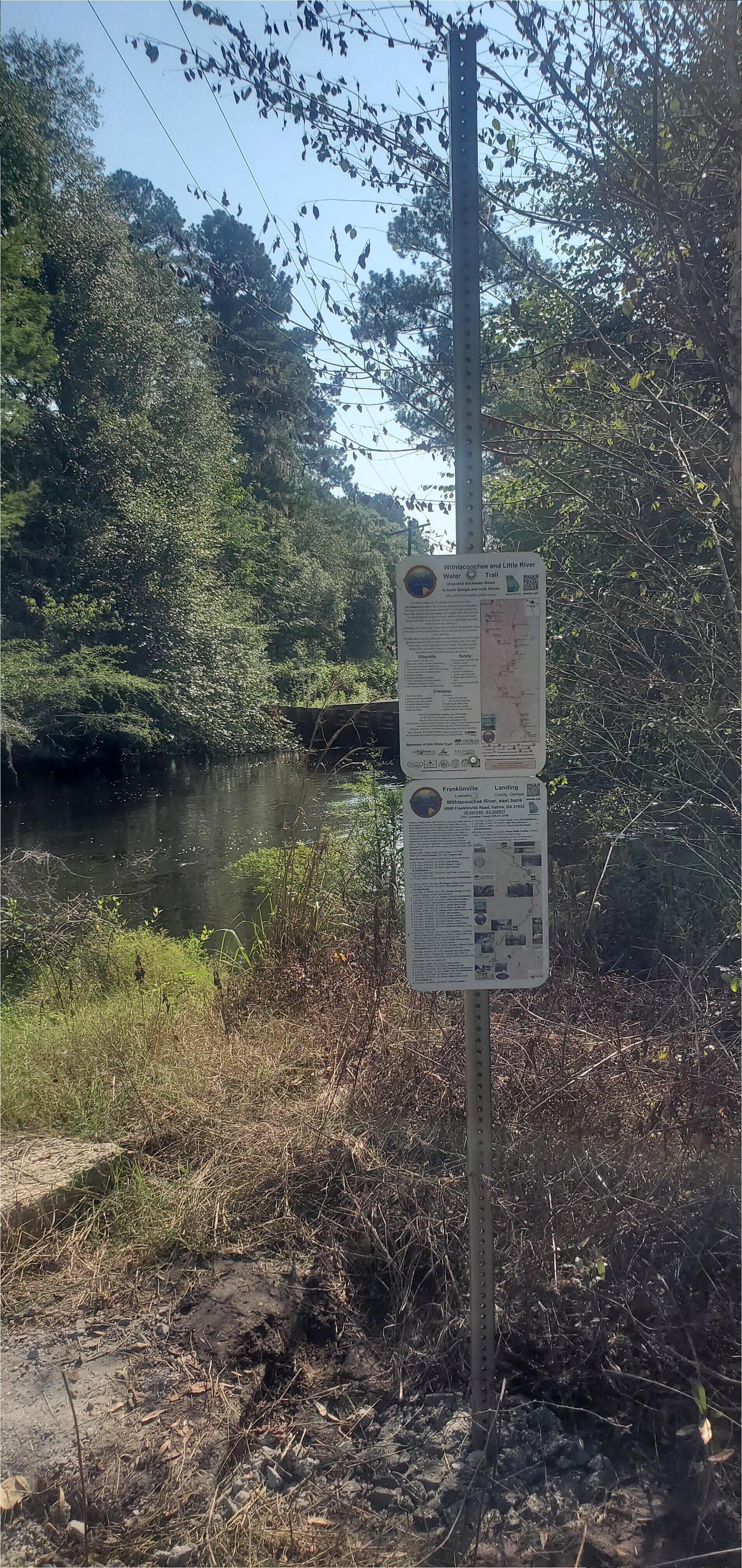 After: Two signs, vertical signpost