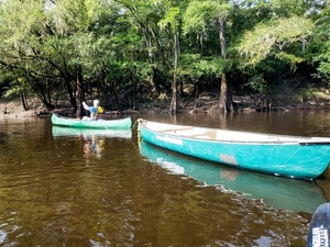 [William Szalkay with WWALS canoes as trash barges, 10:12:22, 30.7119313, -83.4555102]