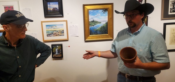 WWALS Board Member and Sponsor Bret Wagenhorst and Chris Adams with turpentine clay pot