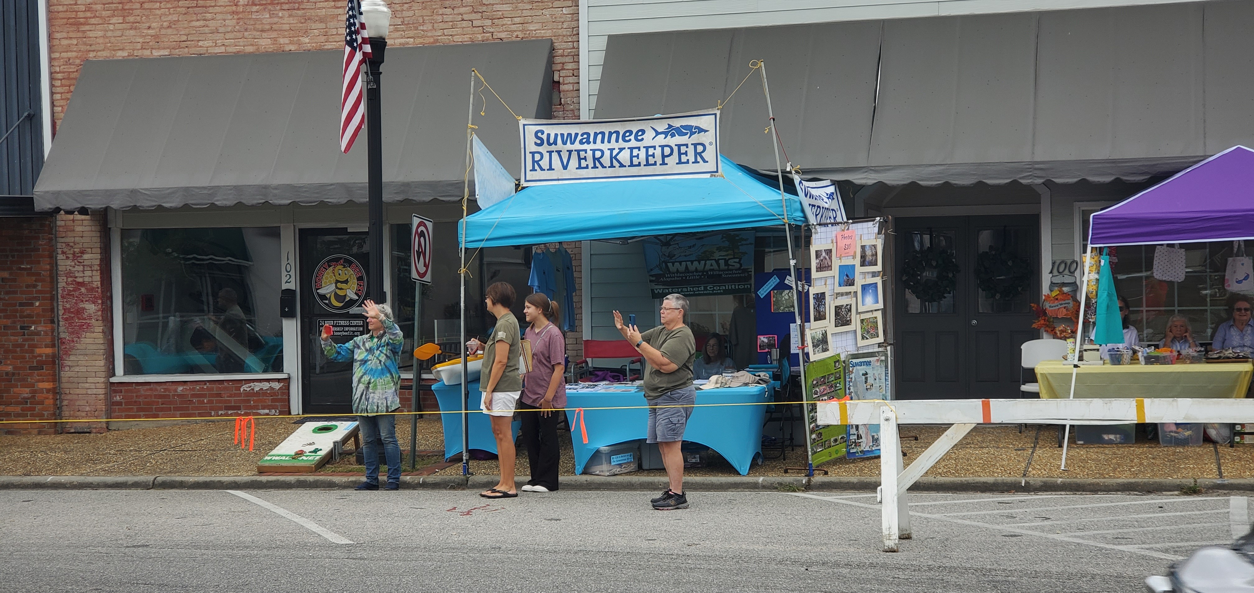 Gretchen Quarterman and Jan Powell greeting antique cars