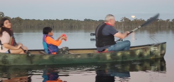 Canoe moon above cypress