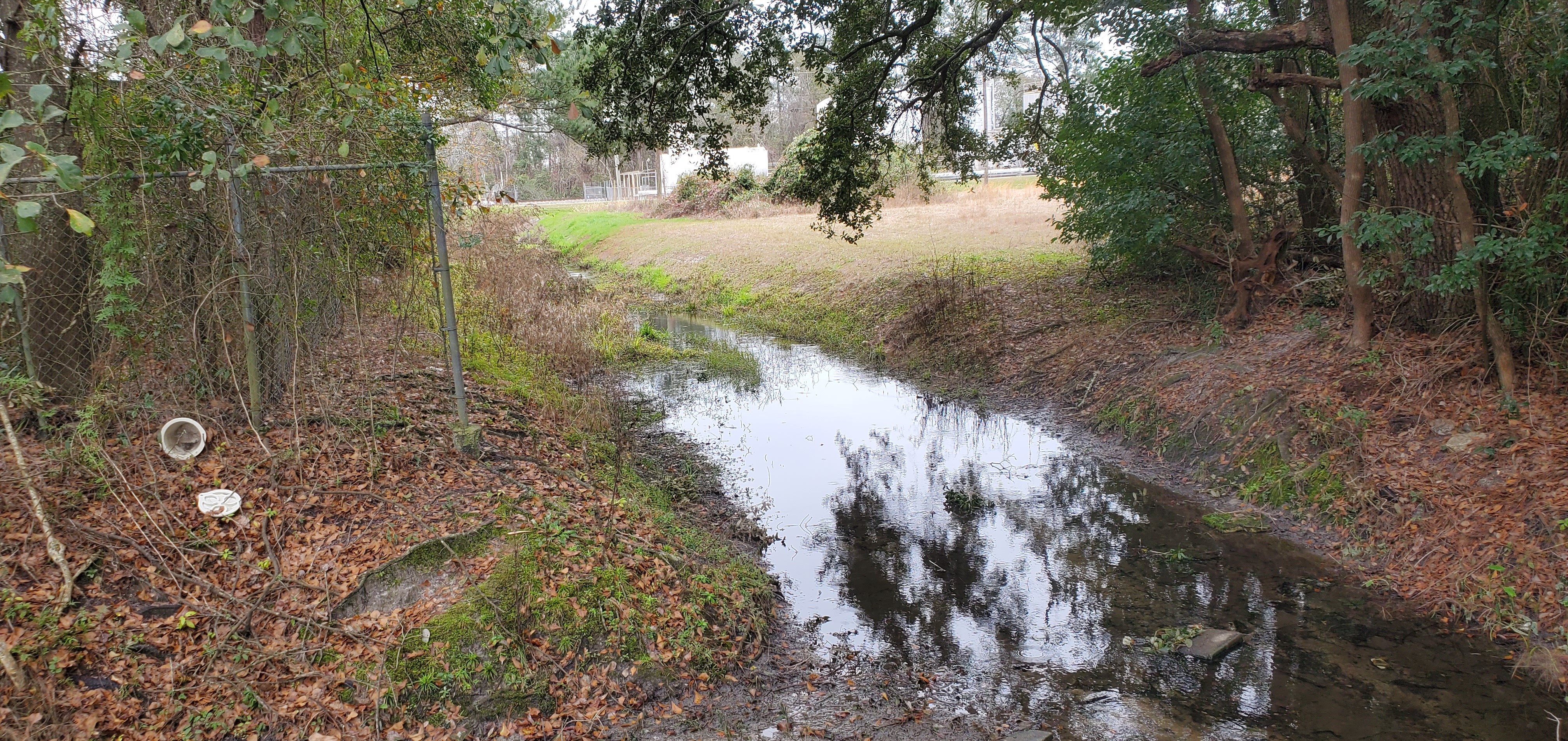 Looking up to E Hill Ave (US 84) along Knights Creek Cypress Street, 11:53:19, 30.8402350, -83.2560096