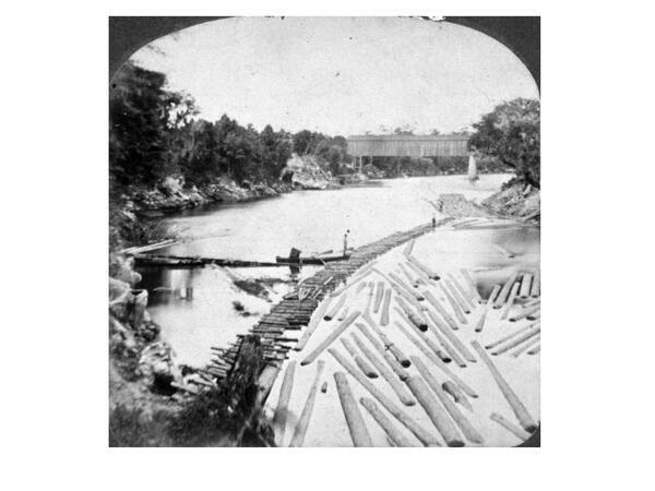 Photo: Ellaville log boom and bridge