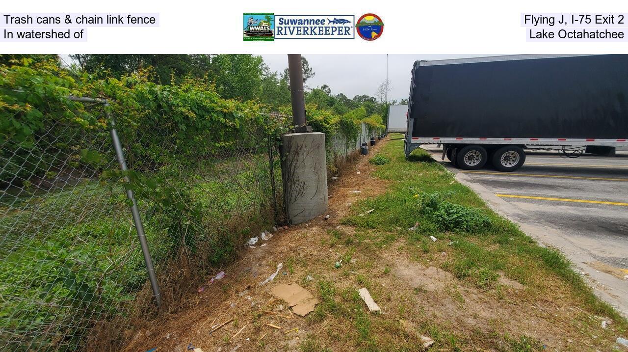 Trash cans & chain link fence, Flying J, I-75 Exit 2, In watershed of Lake Octahatchee