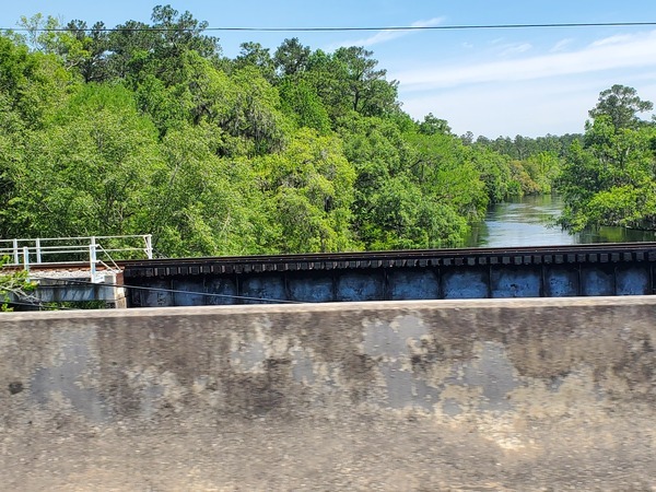 [Suwannee River and Norfolk Southern Railroad Bridge from the US 41 highway bridge, 11:56:26, 30.3256144, -82.7380474]