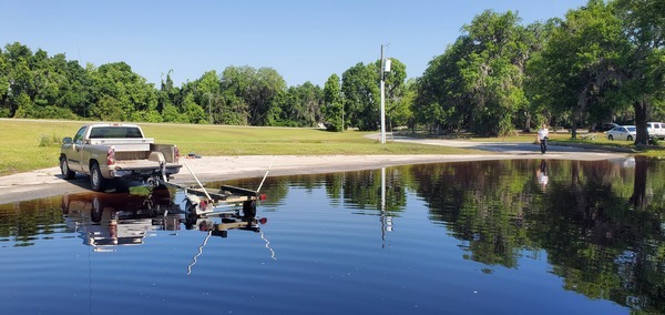 FWS photographer Renee Bodine coming to get in the boat, 10:34:51, 30.6821984, -82.5606969