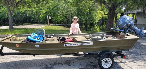 Shirley Kokidko with Suwannee Riverkeeper vessel and 25hp outboard paid for by Wild Green Future, 12:03:56, 30.6825714, -82.5606519