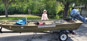 [Shirley Kokidko with Suwannee Riverkeeper vessel and 25hp outboard paid for by Wild Green Future, 12:03:56, 30.6825714, -82.5606519]