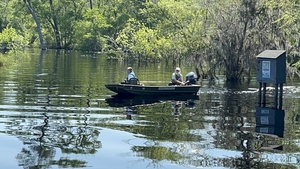 [Turning around, FWS photographer Renee Bodine with Suwannee Riverkeeper, 11:40:02, 30.6820750, -82.5607306]