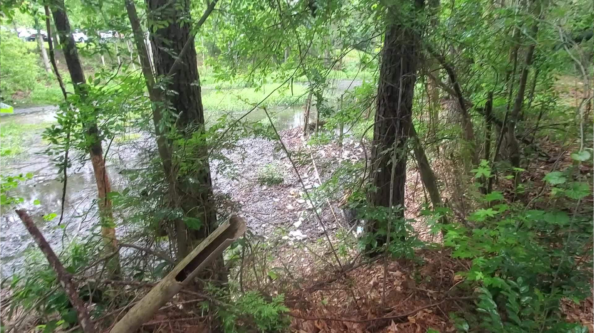 Bandaid on a flesh wound, field fence for trash, detention pond, Baytree Road, Sugar Creek 2023-05-23