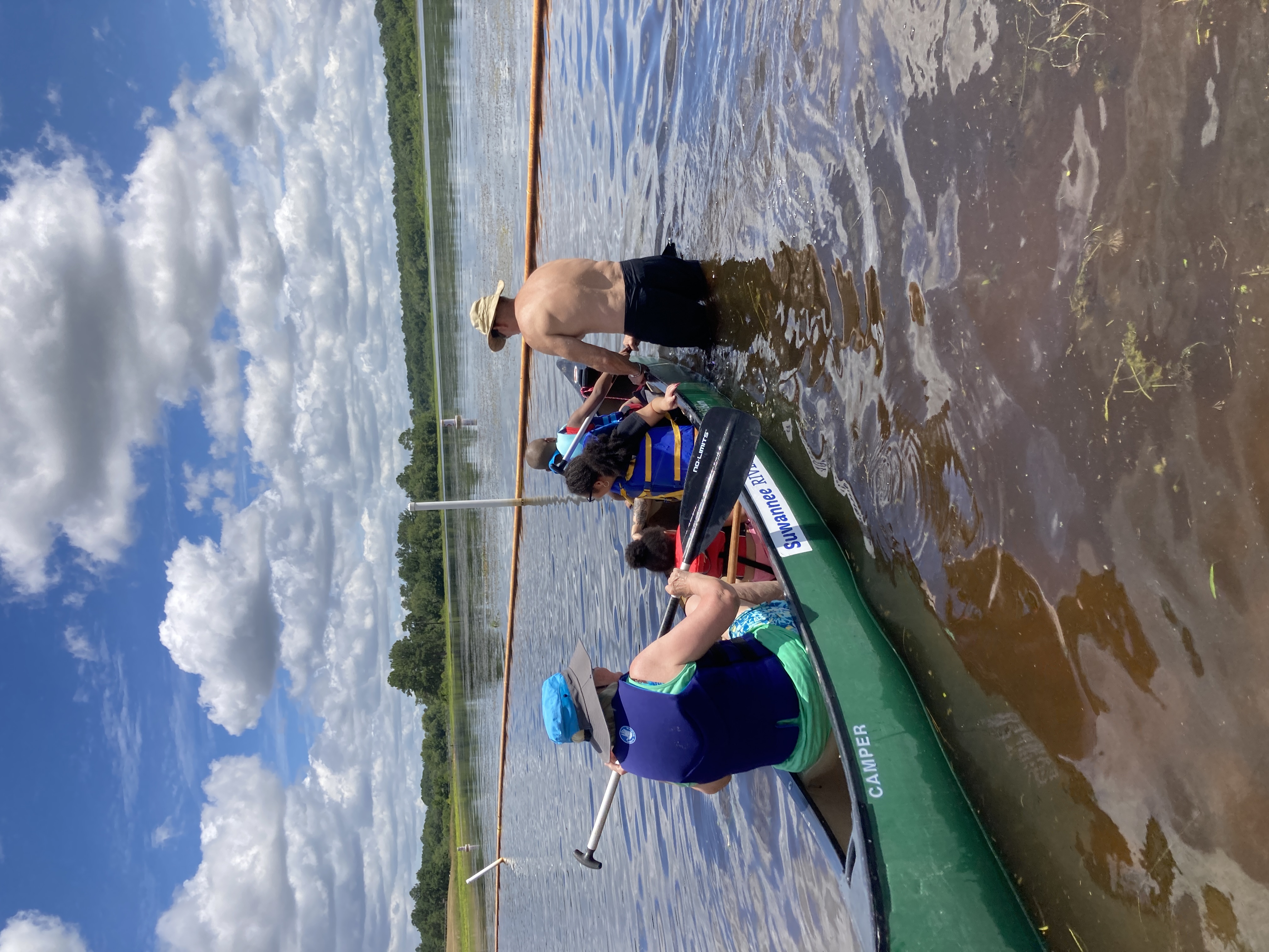 Children and Jo in the Camper canoe, Dan Phillips helping, 12:27:41 --Gretchen Quarterman