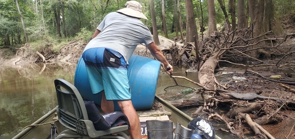 Quen netting trash in Okapilco Creek, 14:11:39, 30.7570720, -83.4919100