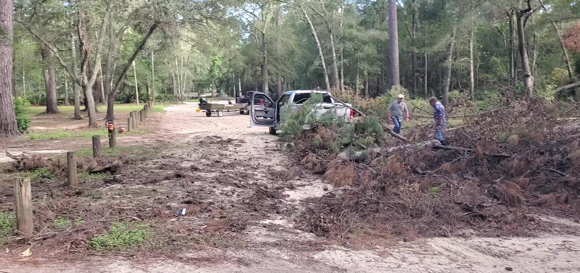 Movie: Two people from Live Oak, FL, removing a deadfall from VLPRA's Langdale Park entrance road, 09:18:32, 30.8866027, -83.3230536 (71M)