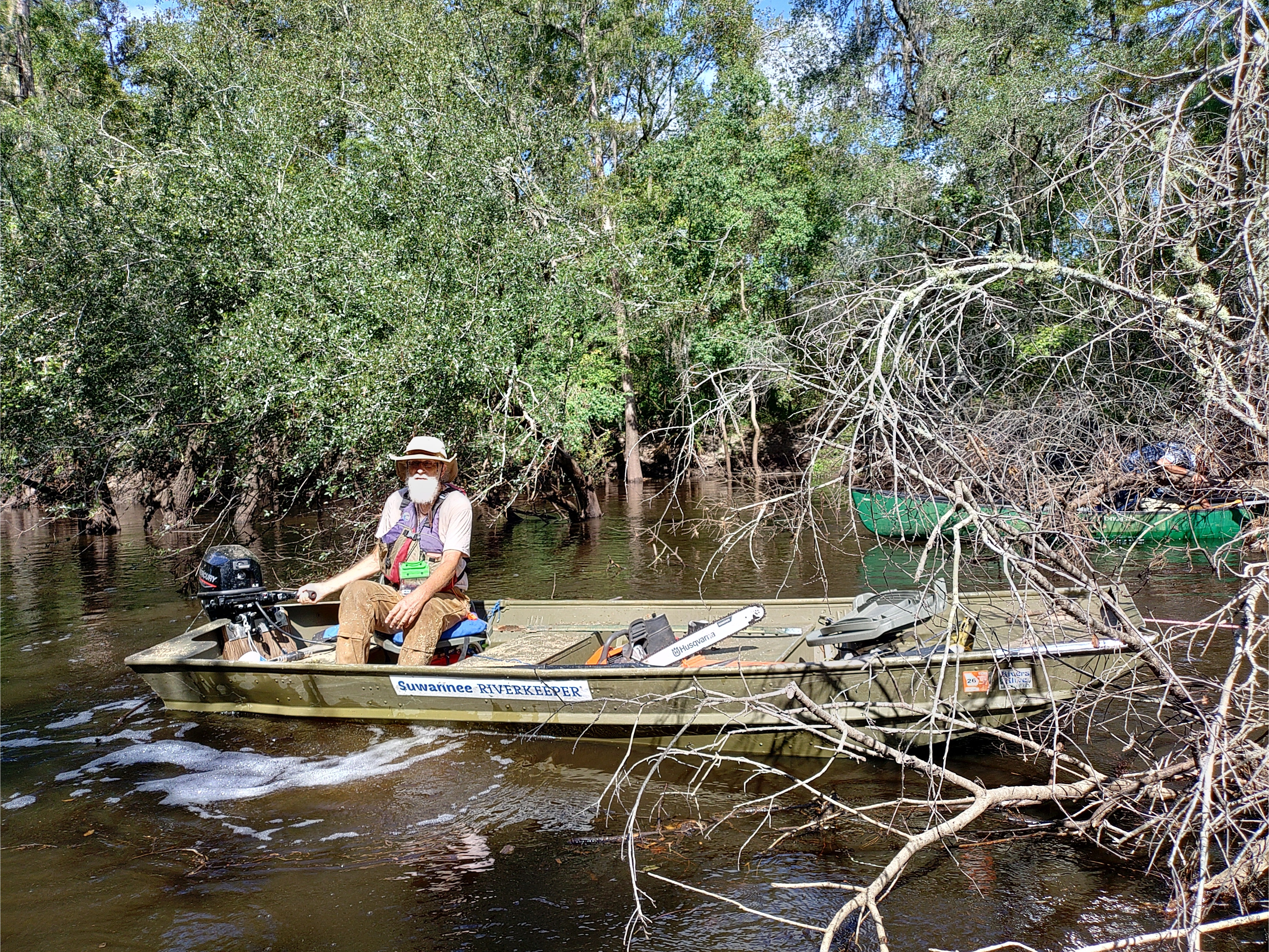 Suwannee Riverkeeper jon boat attempting to pull debris --Phil Royce, 10:40:53, 30.89038, -83.32129