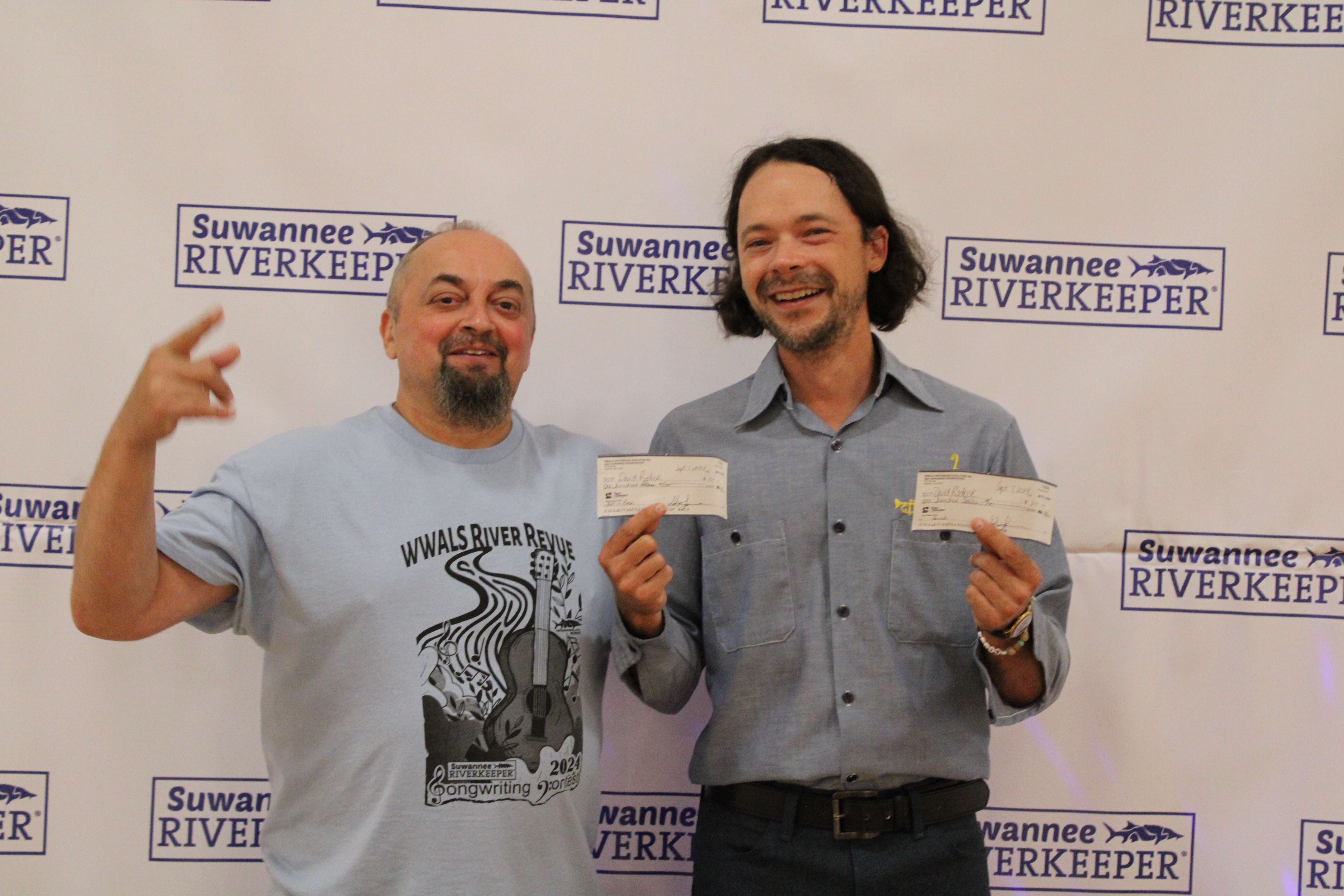 Scotti Jay and David Rodock with David's checks --Karen Corbin