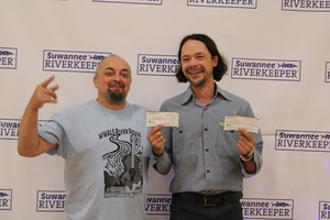 [Scotti Jay and David Rodock with David's checks --Karen Corbin]