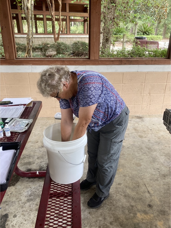 Heather Brasell of Alapaha, Georgia, gets a sample from the bucket --Gretchen Quarterman