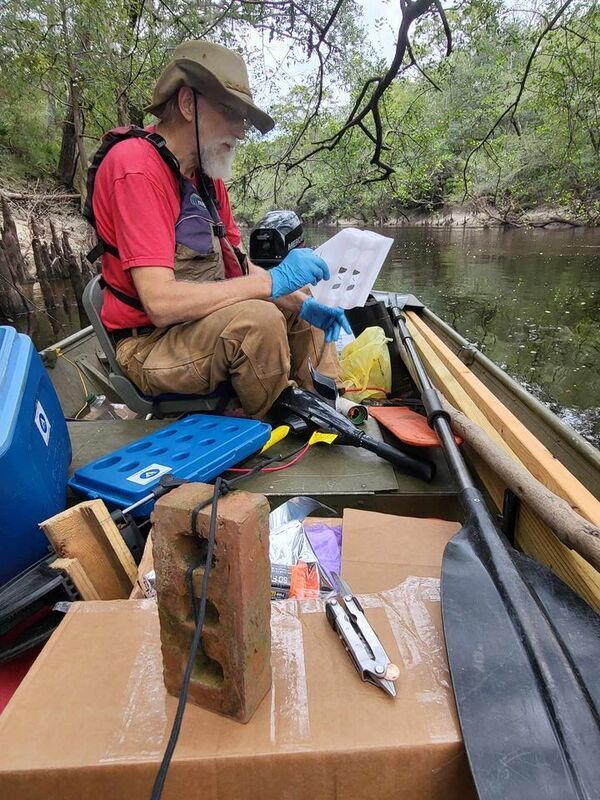 [Preparing the upstream PFAS sampler --Troy Toreson, 30.8364070, -83.3591637]