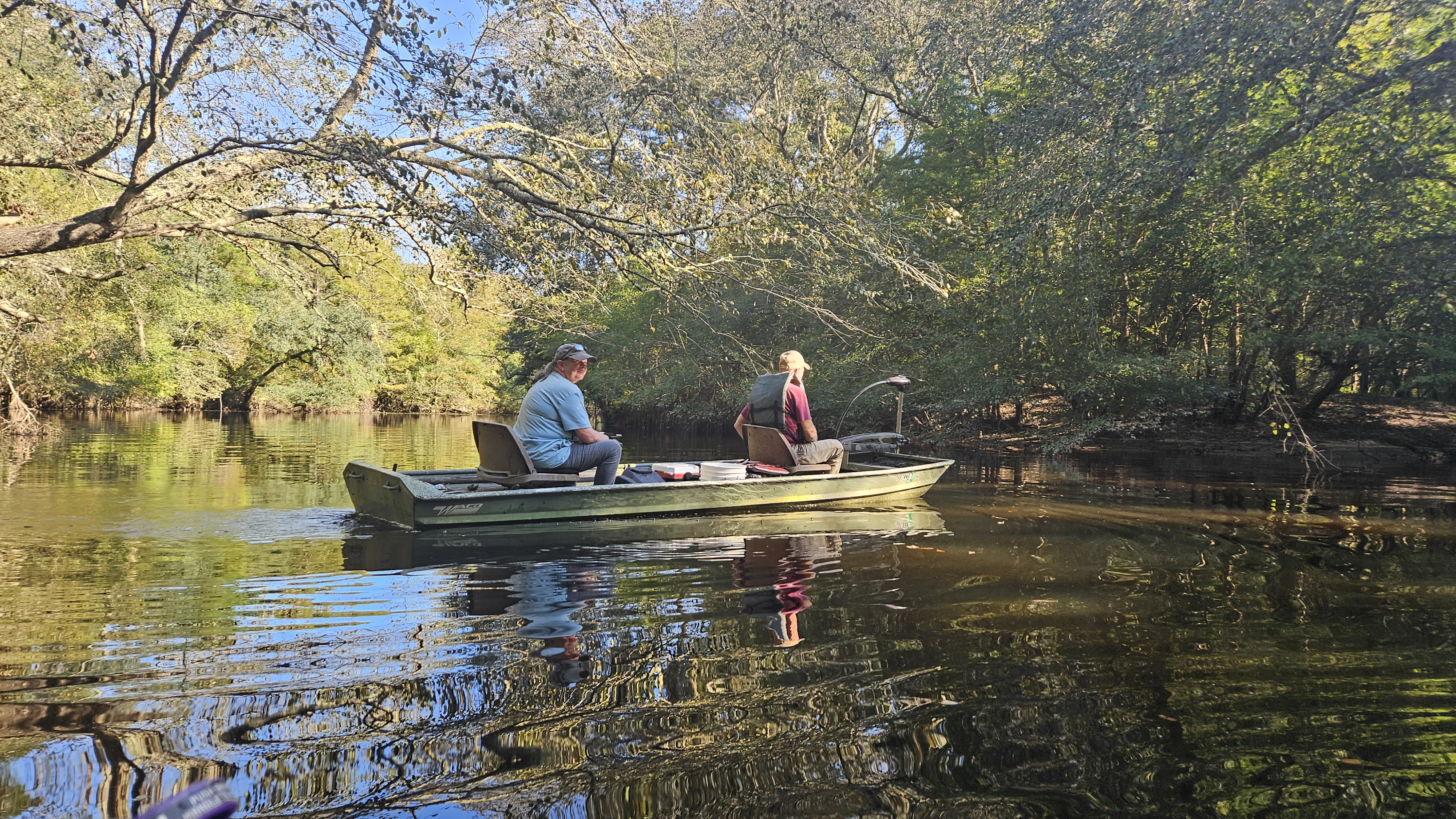 Paris and Tommy cruising with trolling motor on Rountree Lake --Darlene Eanes Ray, 09:50:27, 31.1968432, -83.5205111