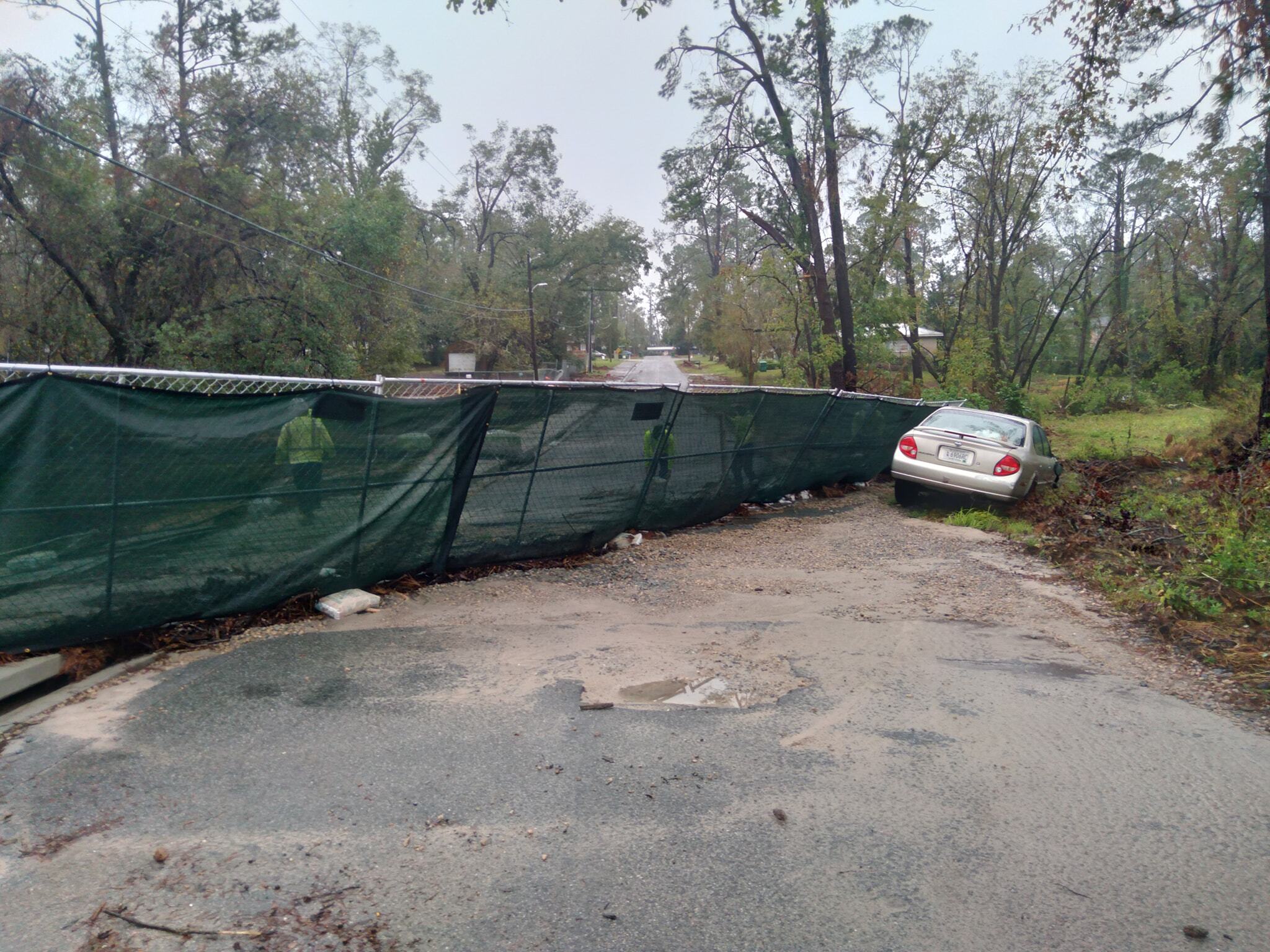 Car in ditch with road closed --Scotti Jay