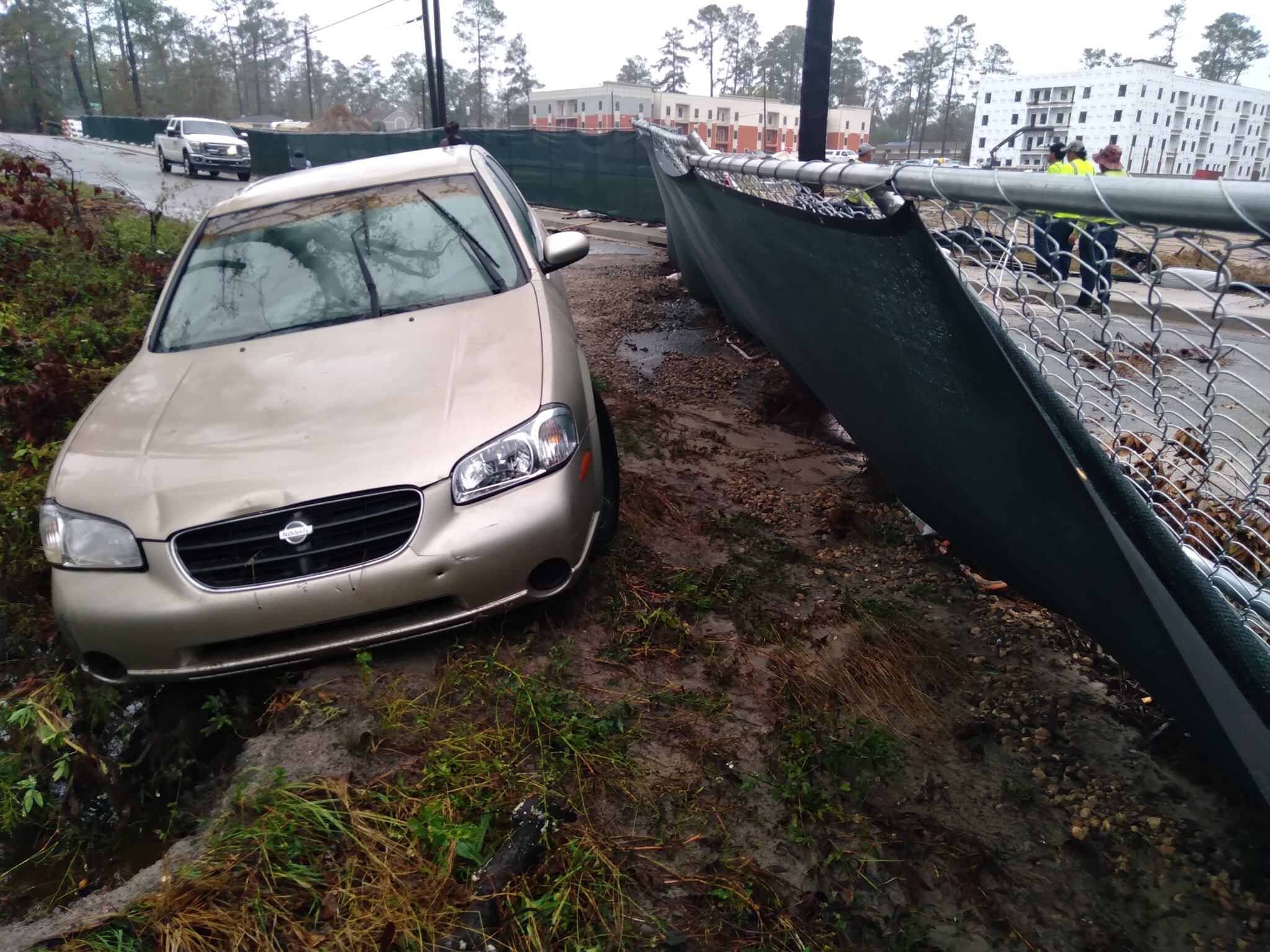 Car stalled out in high water. Then the creek pushed it off the road into ditch. --Scotti Jay