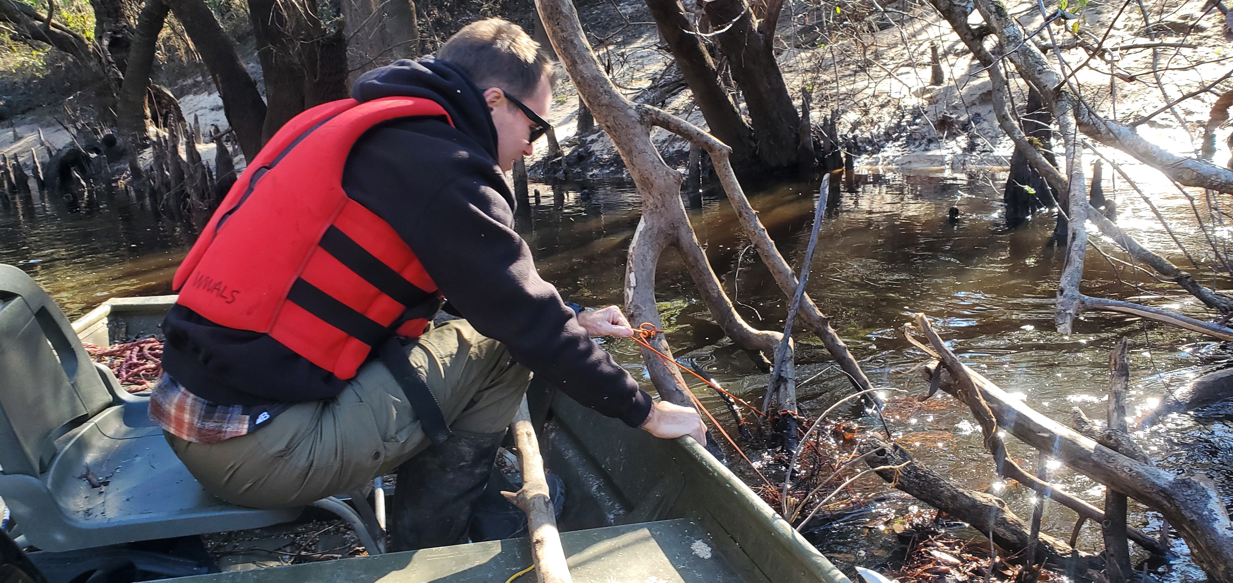 PFAS collector under a mass of debris below Spring Branch, 13:49:49, 30.8285963, -83.3856886