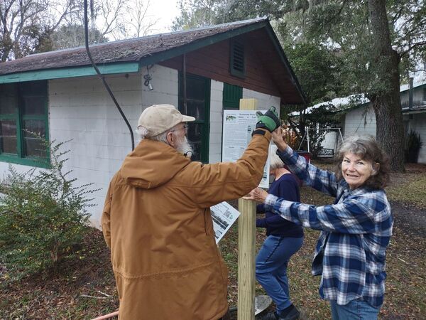 [Linda with the top sign, about the whole Suwannee River Water Trail --Richard Fowler]