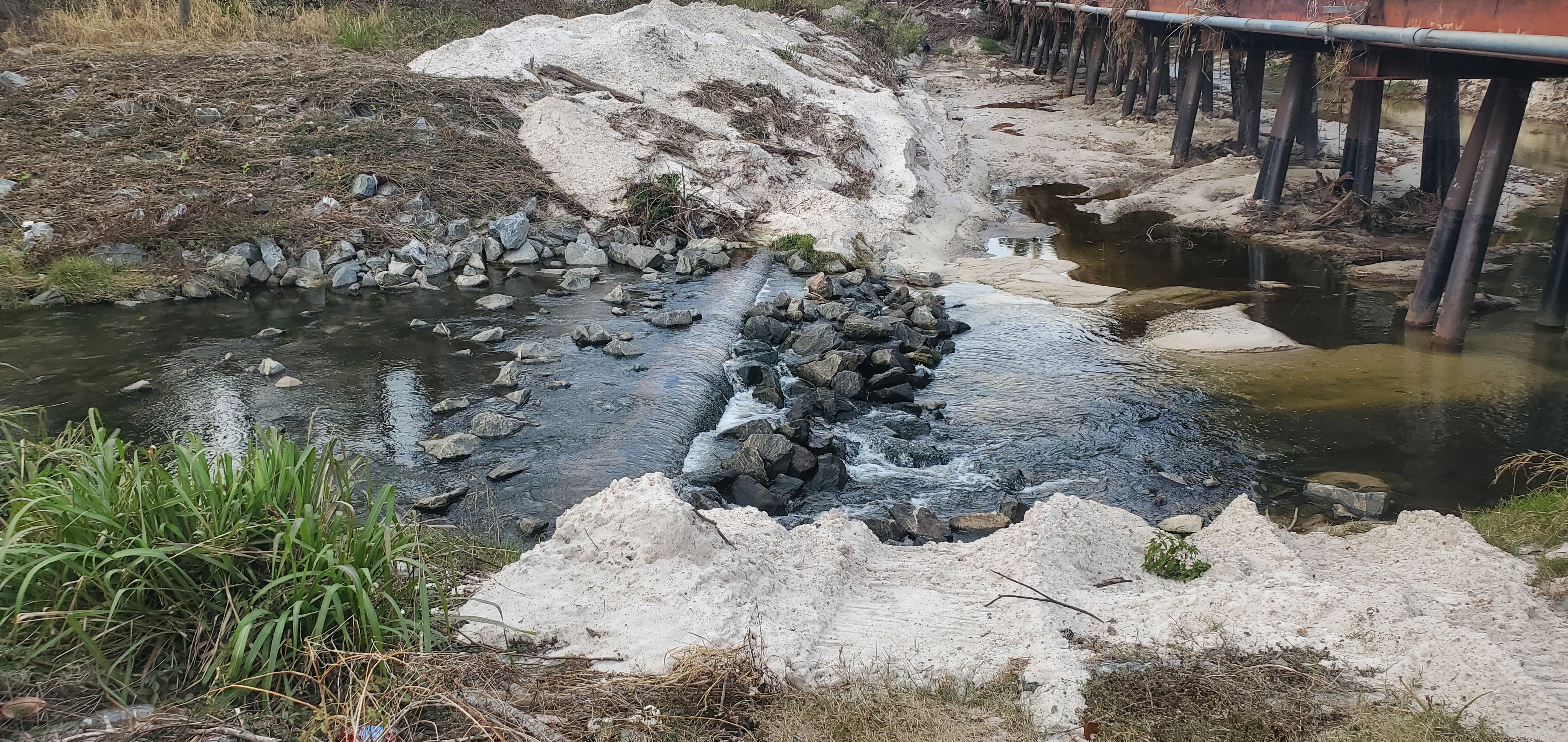 Closeup, Sewer line above Norfolk Southern Railroad Trestle, Sugar Creek, 14:26:28, 30.8518247, -83.3149437