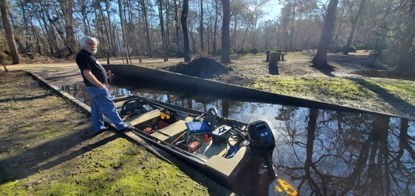 Phil Hubbard with WWALS jon boat, saws, 9.9hp outboard, prop guard at Langdale Park Boat Ramp, 2025:02:09 09:39:36, 30.8876379, -83.3237178