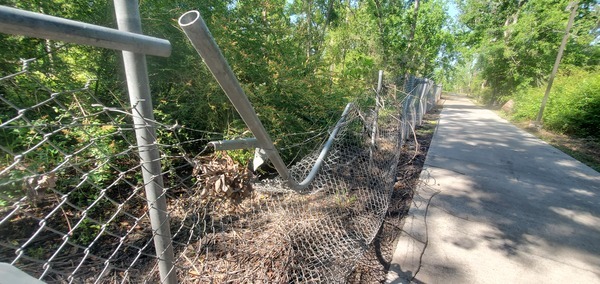[Barbed wire over bent chainlink fence, Azalea City Trail, 10:27:23, 30.8429134, -83.3000878]