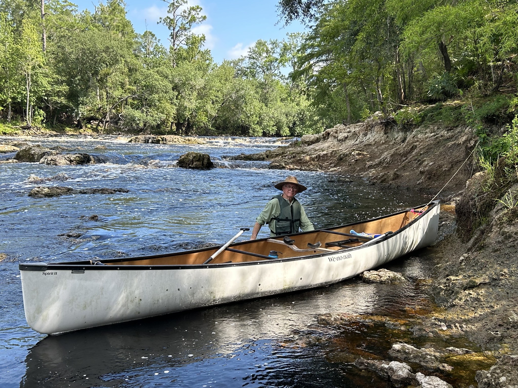 Dennis Price walking his canoe around Big Shoals --Shirley Kokidko