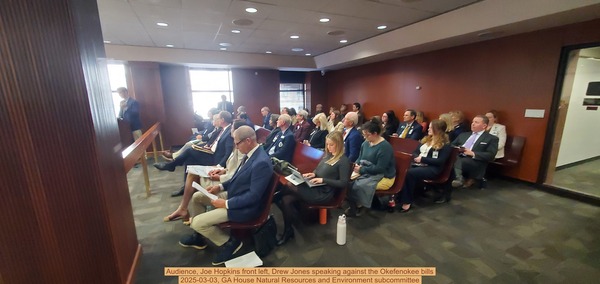 [Audience, Joe Hopkins front left, Drew Jones speaking against the Okefenokee bills, 2025-03-03, GA House Natural Resources and Environment subcommittee]