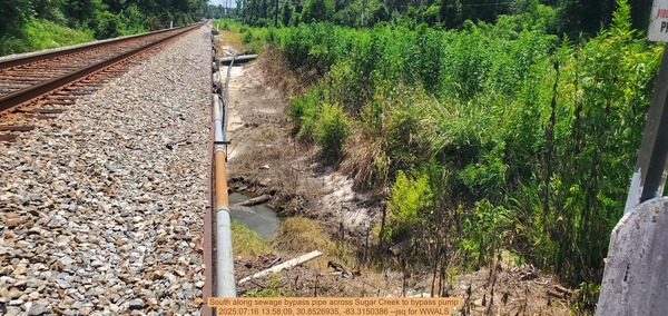 South along sewage bypass pipe across Sugar Creek to bypass pump, 2025:07:16 13:58:09, 30.8526935, -83.3150386 --jsq for WWALS