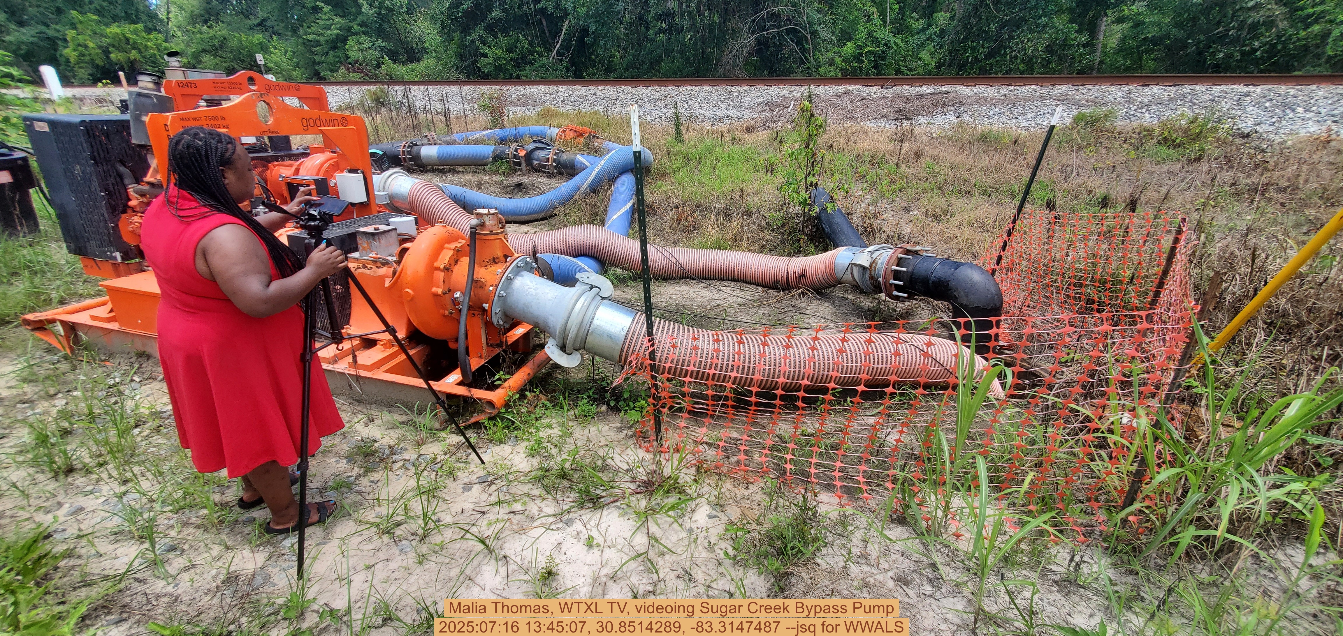 Malia Thomas, WTXL TV, videoing Sugar Creek Bypass Pump, 2025:07:16 13:45:07, 30.8514289, -83.3147487 --jsq for WWALS