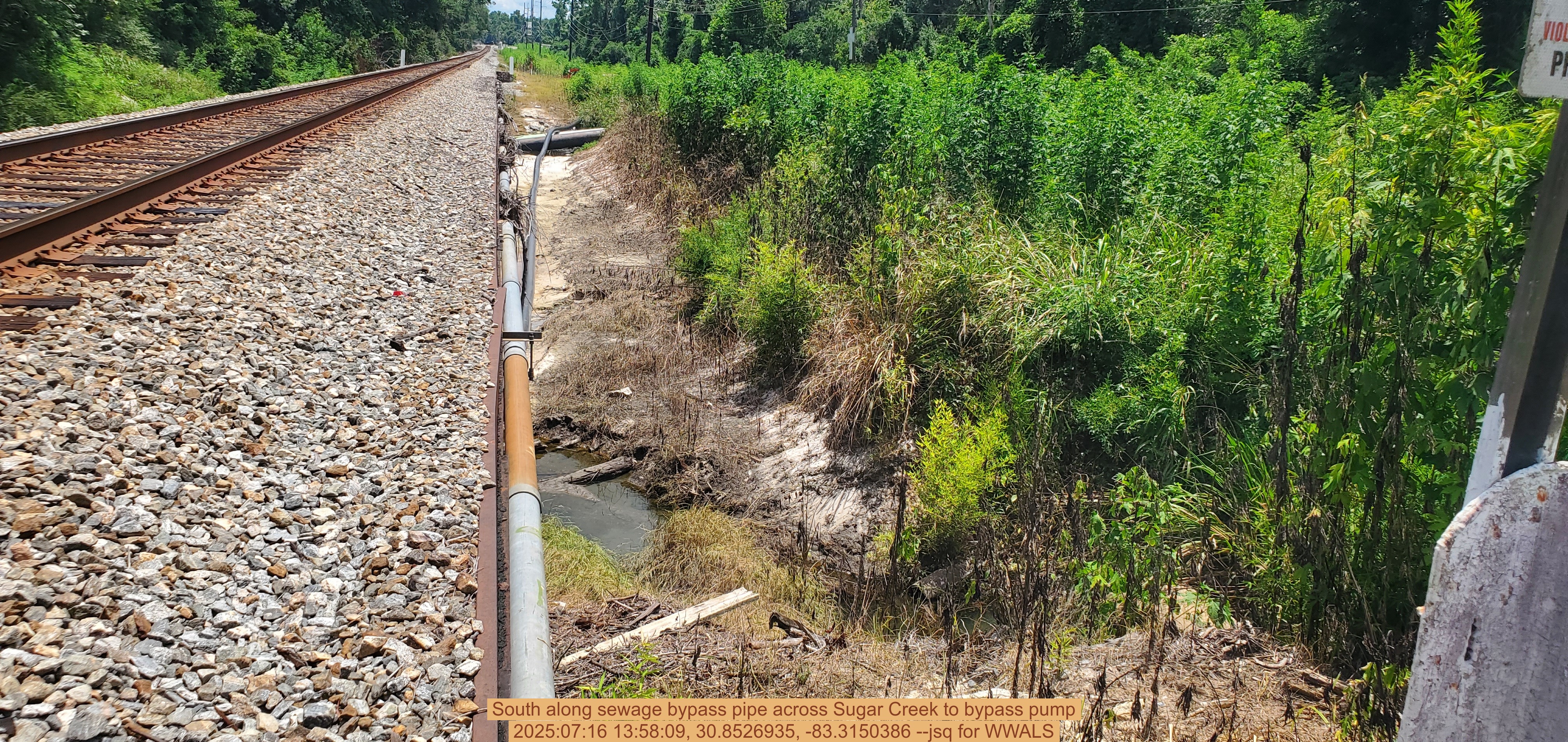 South along sewage bypass pipe across Sugar Creek to bypass pump, 2025:07:16 13:58:09, 30.8526935, -83.3150386 --jsq for WWALS