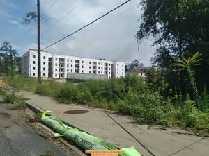[Apartments building just upstream, 2025-08-23 --Scotti Jay]
