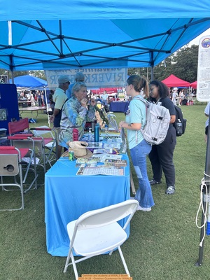 [Gretchen and students at WWALS Booth, 2025-08-28 --Gretchen Quarterman for WWALS]