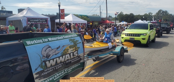 [Cindy Vedas paddling in the parade, 2023-10-07 --jsq for WWALS at Hahira Honeybee Festival]