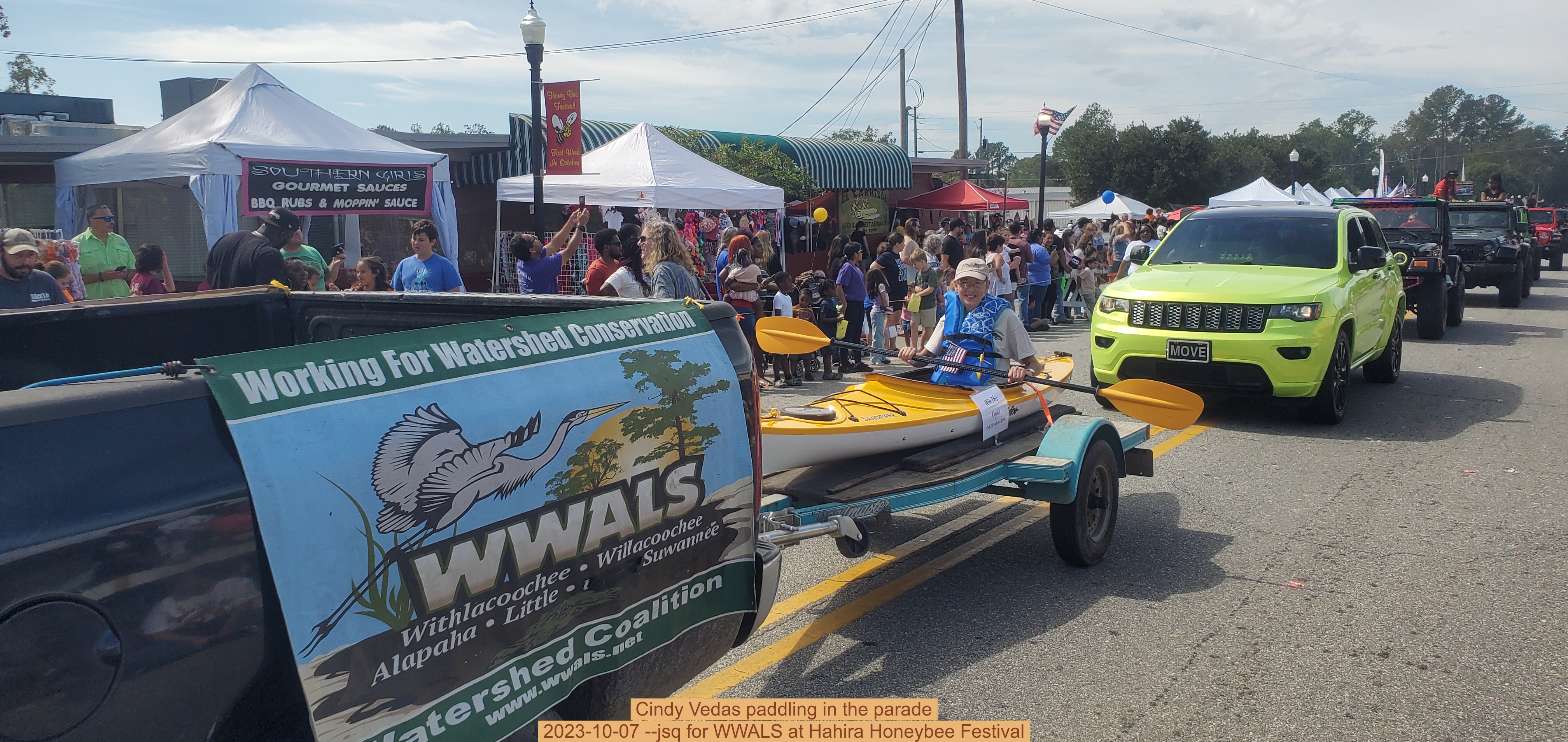 Cindy Vedas paddling in the parade, 2023-10-07 --jsq for WWALS at Hahira Honeybee Festival