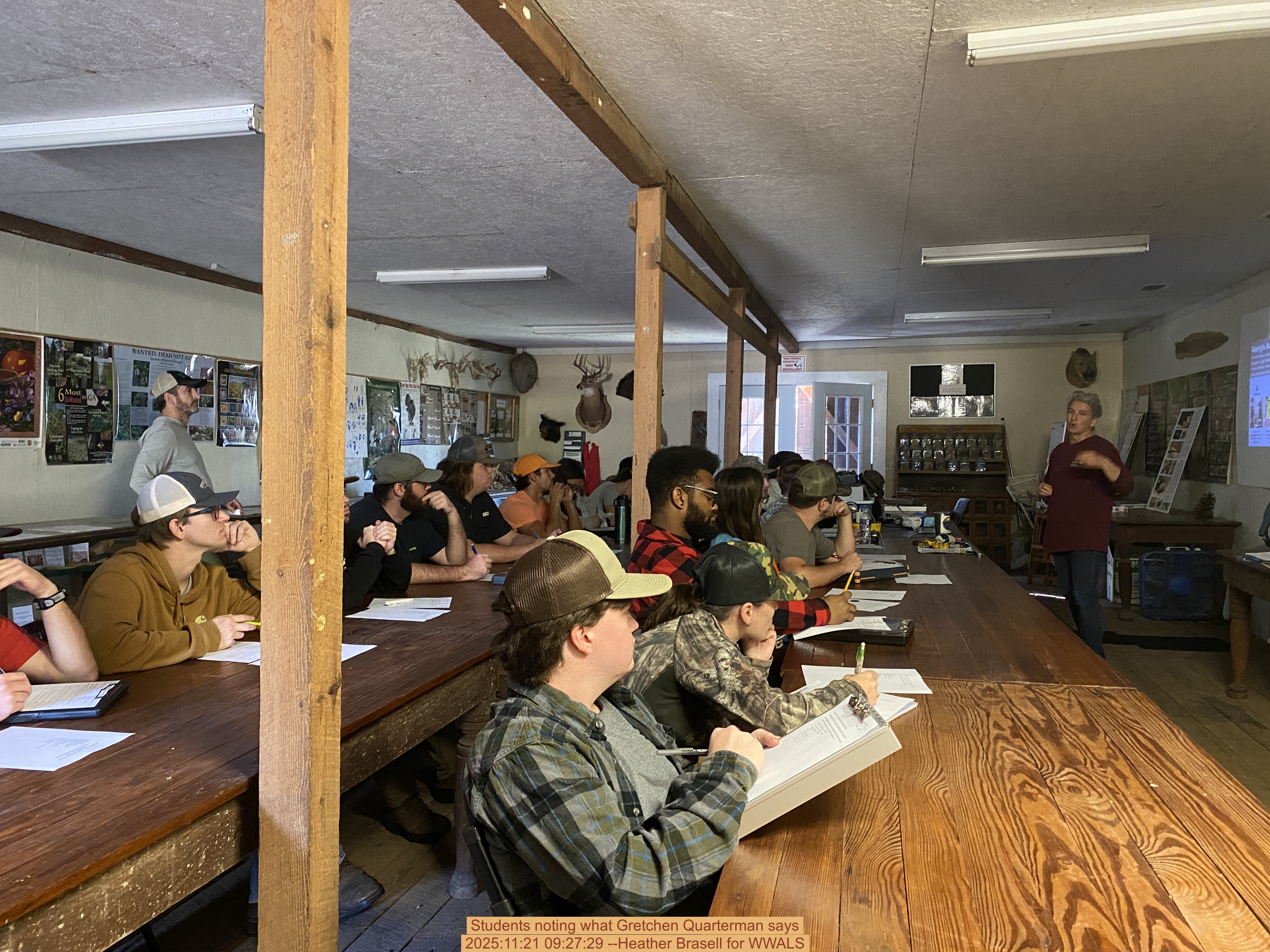 Students noting what Gretchen Quarterman says, 2025:11:21 09:27:29 --Heather Brasell for WWALS