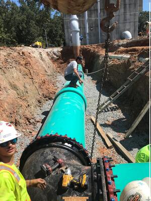 [Photograph: Gravel under pipe, 2025-12-11 --VCC Packet]