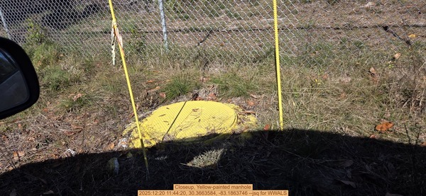 Closeup, Yellow-painted manhole, 2025:12:20 11:44:20, 30.3663584, -83.1863746 --jsq for WWALS