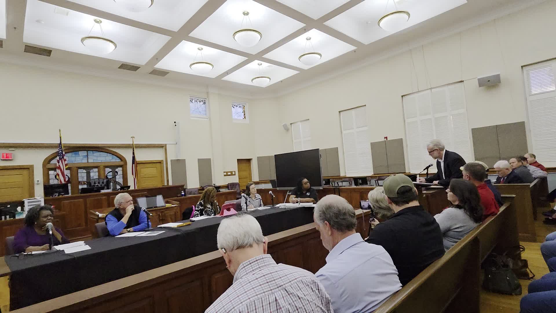 Movie: Dr. Erik Bernstein, was at Tift Regional, drove from Savannah for the hearing, has property about a mile from the subject site. Concerned about rural area, hunting, dark sky, water, aquifer, and river. Proposed site is currently all conservation land. (287M)